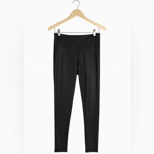 JoyLab size medium black sparkly leggings with pocket for essentials.